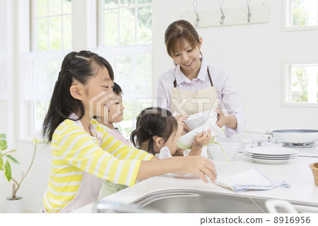 A Japanese family standing in the kitchen A Japanese family standing in the kitchen 8916956