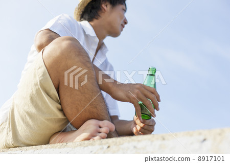 A man sitting by putting an agar 8917101