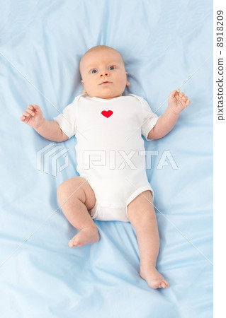 infant on a blue diaper 8918209