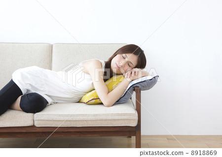 A woman lying on the sofa A woman lying on the sofa 8918869