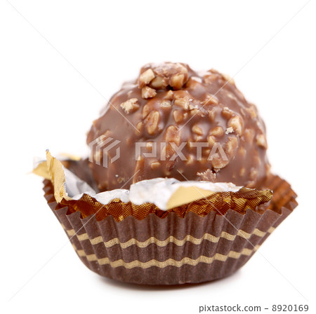 Chocolate gold bonbon with nuts. 8920169