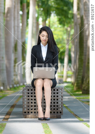 Young Office Lady using laptop outdoor 8921657