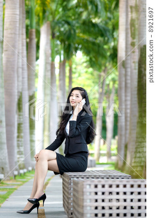 Young Office Lady making phone call outdoor 8921697