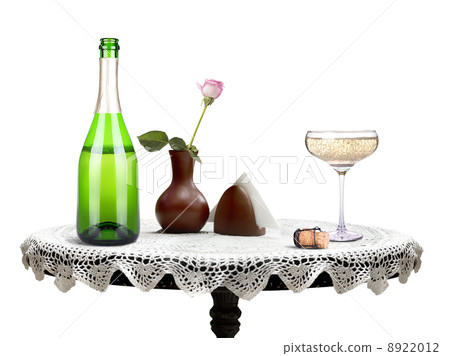 bottle of champagne and glass on a table bottle of champagne and glass on a table 8922012