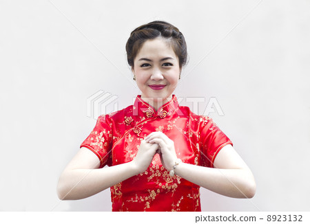 happy Chinese new year. beautiful Asian woman with gesture of co 8923132