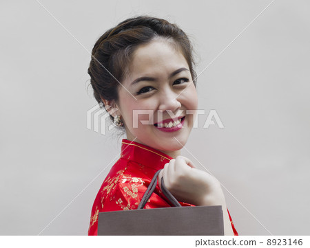 pretty woman in red Traditional Chinese Cheongsam with shopping pretty woman in red Traditional Chinese Cheongsam with shopping 8923146