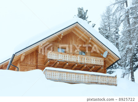 wood house in winter misty mountain 8925722