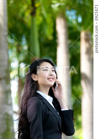 Young Office Lady on the phone outdoor 8925871