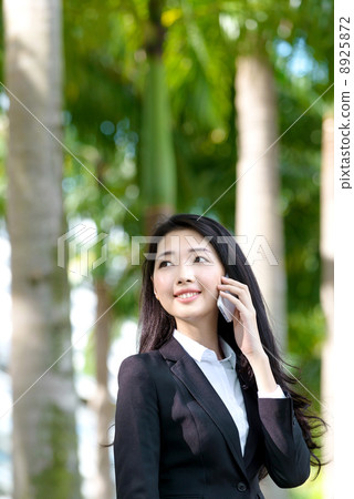 Young Office Lady on the phone outdoor 8925872