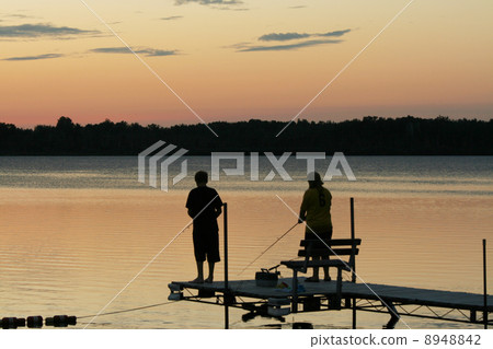 Silhouette of children fishing Silhouette of children fishing 8948842
