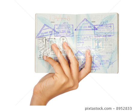 Hand showing passport, close-up shot Hand showing passport, close-up shot 8952833