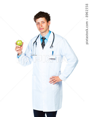 Portrait of a male doctor holding green apple on white Portrait of a male doctor holding green apple on white 8961558