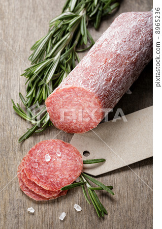 italian salami sausage slices with rosemary and sea salt italian salami sausage slices with rosemary and sea salt 8965236