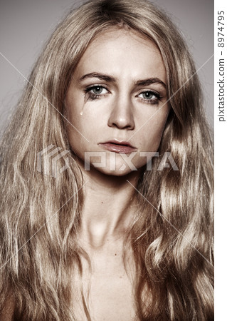 Sad woman with tears in her eyes Sad woman with tears in her eyes 8974795