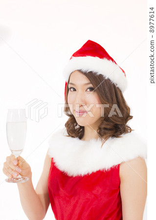 Santa girl drinking champagne Santa girl drinking champagne 8977614