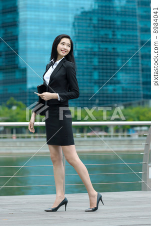 Young Office Lady Along Waterway Young Office Lady Along Waterway 8984041