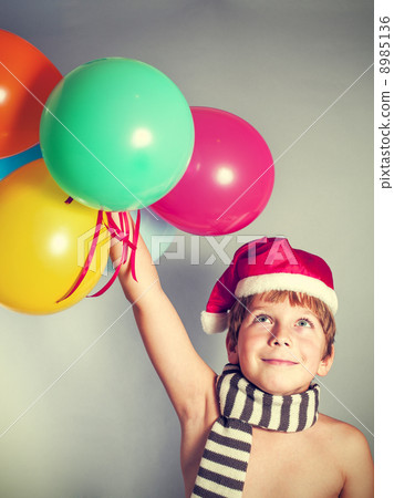 boy in Santa Claus hat 8985136