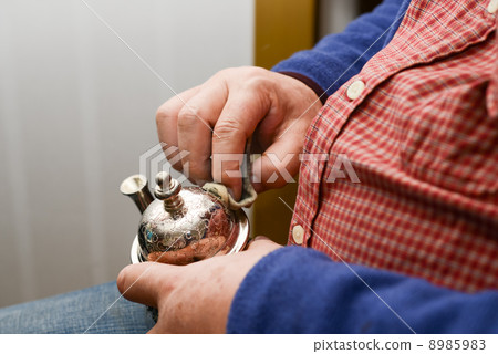 Men polishing metalware Men polishing metalware 8985983