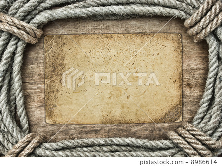 frame made of twisted rope and old paper on a wooden background frame made of twisted rope and old paper on a wooden background 8986614