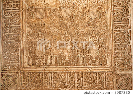 Antique carved ornament in Alhambra, Spain 8987280