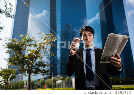 Businessman in the City reading Papers Businessman in the City reading Papers 8991753