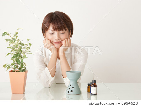 A woman enjoying aromatic oil A woman enjoying aromatic oil 8994628