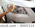 Hand with a wipe the car polishing 9005314