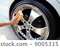 Hand with a microfiber wipe the car polishing 9005315