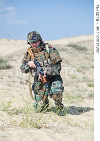 soldier with AK rifle soldier with AK rifle 9009742