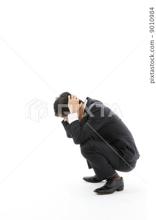 Businessman holding his head Businessman holding his head 9010984