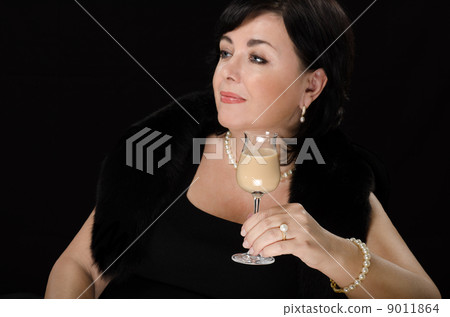 Woman drinking cream liqueur Woman drinking cream liqueur 9011864