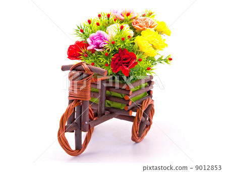 beautiful and colorful flower bouquet in wooden basket in car sh 9012853