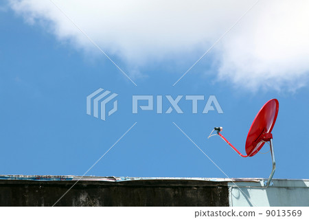 isolated red satellite on sunny blue sky isolated red satellite on sunny blue sky 9013569