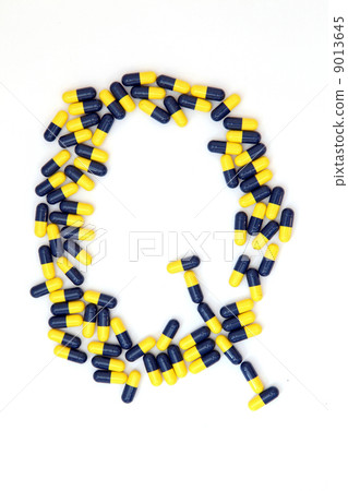 The letter Q alphabet made of medical capsules 9013645