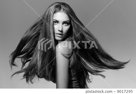 Black and White Fashion Model Girl Portrait with Blowing Hair 9017295