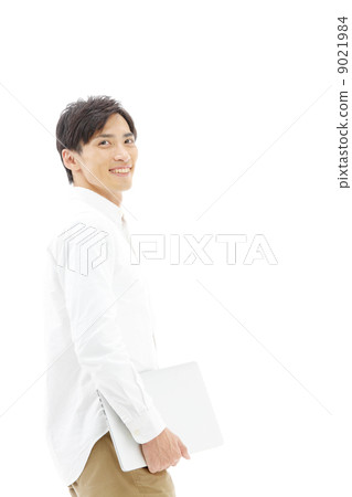 A man with a laptop computer 9021984