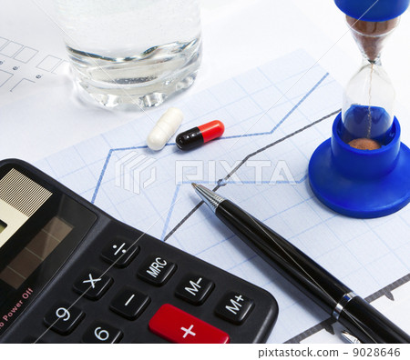 Financial charts and a bunch of keys on the table Financial charts and a bunch of keys on the table 9028646