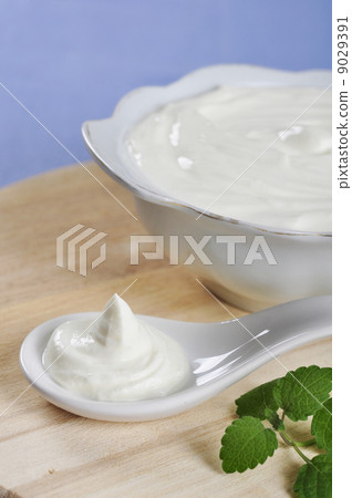 Sour cream in spoon Sour cream in spoon 9029391