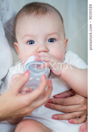 mother feeding by milk his baby infant from bottle mother feeding by milk his baby infant from bottle 9030589