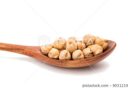pulses in a wooden spoon isolated 9031219