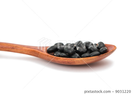 pulses in a wooden spoon isolated 9031220