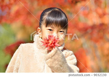 Girls enjoying autumn leaves hunting 9032130