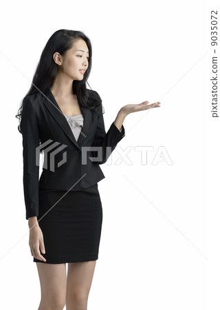 Young business woman presenting studio white background Young business woman presenting studio white background 9035072