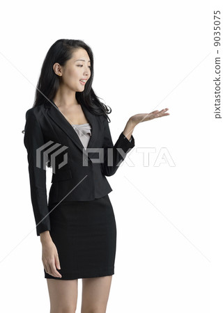 Young business woman presenting studio white background Young business woman presenting studio white background 9035075