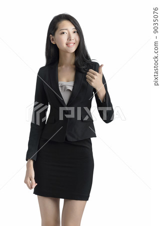 Young business woman thumbs up studio white background Young business woman thumbs up studio white background 9035076