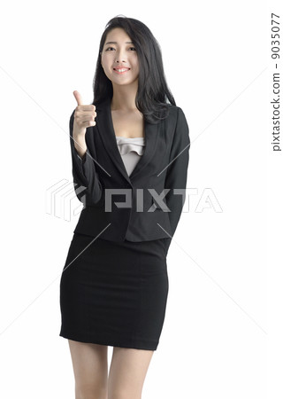 Young business woman thumbs up studio white background Young business woman thumbs up studio white background 9035077
