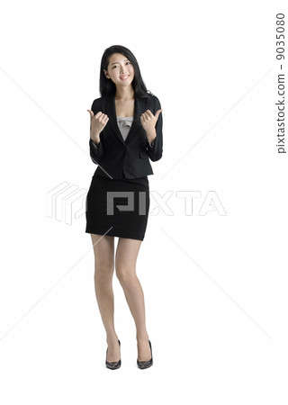 Young business woman thumbs up studio white background Young business woman thumbs up studio white background 9035080