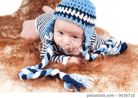 Newborn baby in funny hat 9036710