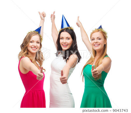 three women wearing hats and showing thumbs up three women wearing hats and showing thumbs up 9043743