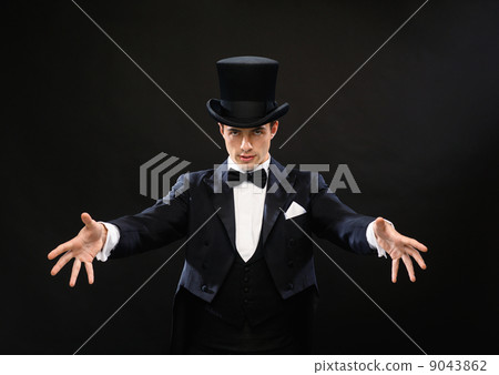 magician in top hat showing trick magician in top hat showing trick 9043862